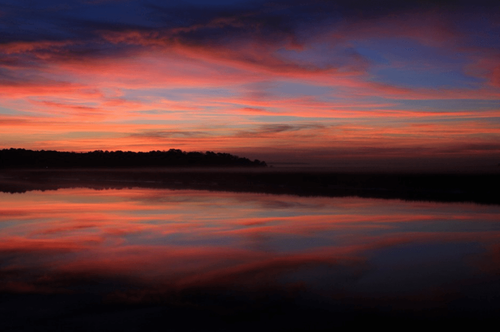 Pink and deep blue Georgia Sunrise over water